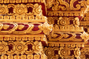 Ancient Thai pattern decorations Golden color in Wat Phra That Cho Hae, Thailand.