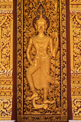 Plakat Interior door of Wat Phra That Cho Hae, Phrae Province, Thailand.
