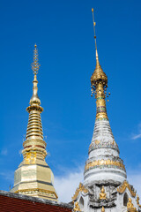 Fototapeta premium The gold pagoda in Wat Phrathat Cho Hae Temple, Phrae Province, Thailand.