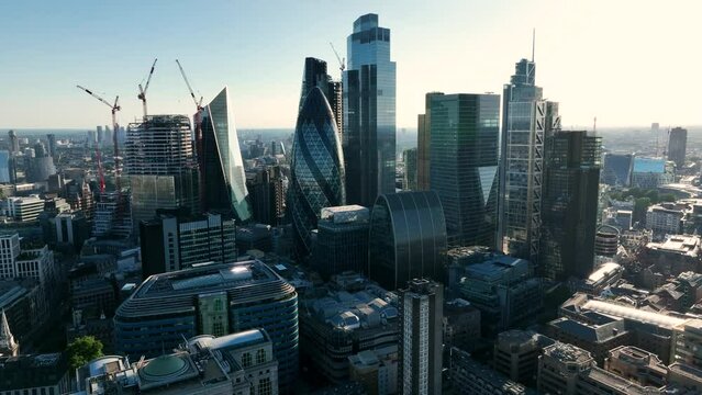 LONDON, UK - 10 JUNE 2022: Establishing Aerial drone View of Gherkin skyscraper with London Skyline, 20 Fenchurch or Walkie Talkie, sky garden by the Thames River, United Kingdom, Europe