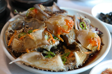 Korean traditional food eaten with fresh live crab seasoned with soy sauce