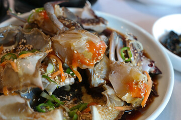 Korean traditional food eaten with fresh live crab seasoned with soy sauce