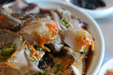 Korean traditional food eaten with fresh live crab seasoned with soy sauce