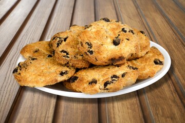 Tasty homemade cookies with chocolate chips on the desk