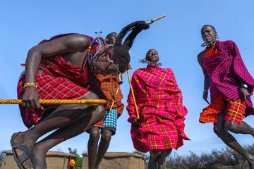 Foto op Canvas Maasai Mara man showing traditional Maasai jumping dance © Mongkolchon