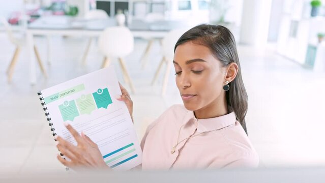 Sales woman consulting via a zoom call from her office showing a program diagram. A young African female advisor talking on a video call presenting a business proposal or plan