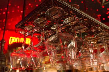 glasses of champagne and wine at pub in red light