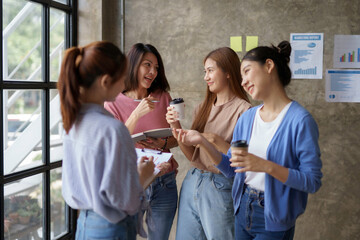 Charming and creative young Asian businesswomen meeting to plan a meeting together marketing strategies, sales strategies to expand the business.