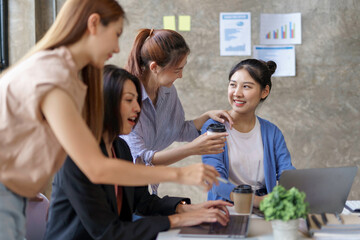 Charming and creative young Asian businesswomen meeting to plan a meeting together marketing strategies, sales strategies to expand the business.