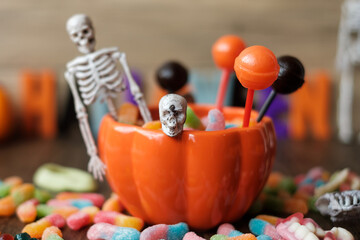 Happy Halloween day with ghost candies, pumpkin bowl, Jack O lantern and decorative (selective...