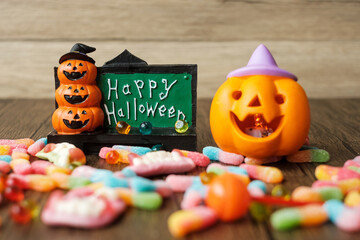 Happy Halloween day with ghost candies, pumpkin, Jack O lantern and decorative (selective focus)....