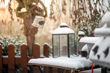 a candle glass in fresh white snow