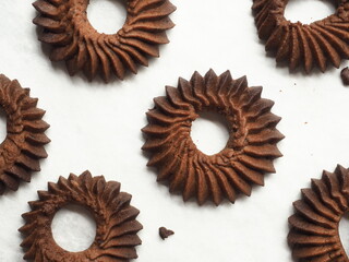 top view chocolate butter cookies in round ruffled edge