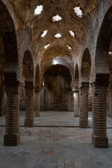 The ruins of the warm room inside the Arab baths, Ronda, Spain. Moorish architecture.
