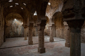 The ruins of the warm room inside the Arab baths, Ronda, Spain. Moorish architecture.