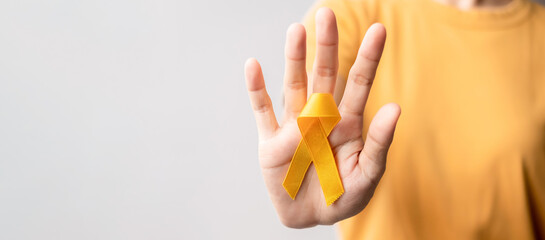 Yellow September, Suicide prevention day, Childhood, Sarcoma, bone and bladder cancer Awareness month, Yellow Ribbon for supporting people life and illness. Healthcare and World cancer day concept