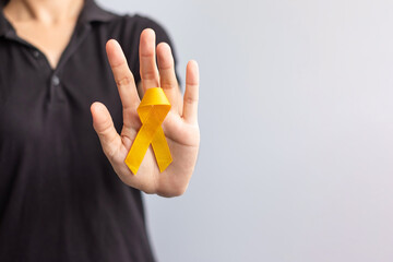 Suicide prevention day, Childhood, Sarcoma, bone and bladder cancer Awareness month, Yellow Ribbon for supporting people life and illness. children Healthcare and World cancer day concept