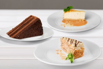 Composition with assorted cakes. Set of dessert. Pieces of cakes