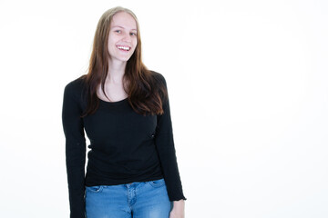 Woman smiling pretty casual girl in blue jeans on white background aside copy space