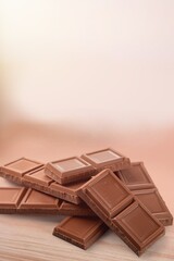 Milk chocolate on a background. Creative chocolate photography.