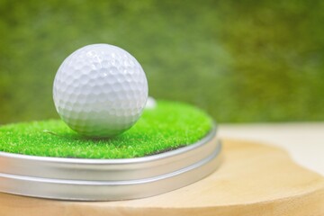 Golf ball is on green grass