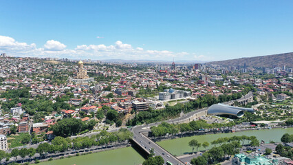 Panoramic view of Tbilisi with Kura River and Sameba Cathedral in August, 2022. Tbilisi, Georgia  © MARCIA COBAR