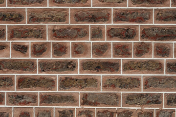 Old brown brick wall. Texture for design. Building material.