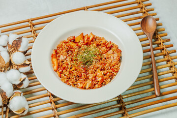Korean food Kimchi Fried Rice Kimchibokkeumbap, Rice fried with finely chopped kimchi. Beef, pork, onions, green onions, and other vegetables may be added according to taste.