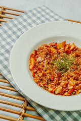 Korean food Kimchi Fried Rice Kimchibokkeumbap, Rice fried with finely chopped kimchi. Beef, pork, onions, green onions, and other vegetables may be added according to taste.