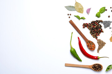 Different cooking ingredients and spices on white background