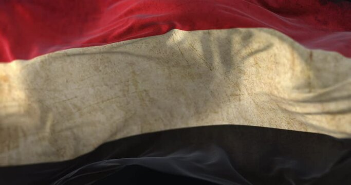 Old Yemen Flag waving at wind. Loop