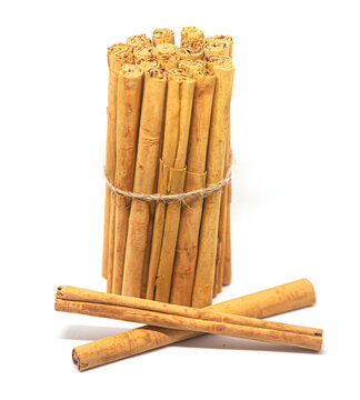 Ceylon cinnamon sticks on white background. Sri Lankan authentic cinnamon. True cinnamon sticks. Pure Ceylon cinnamon. Close up.