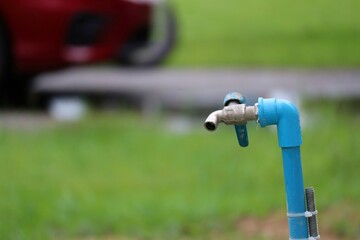 sprinkler spraying water on grass