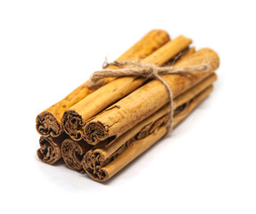Ceylon cinnamon sticks on white background. 4M Sri Lankan authentic cinnamon. True cinnamon sticks. Pure Ceylon cinnamon. Close up.