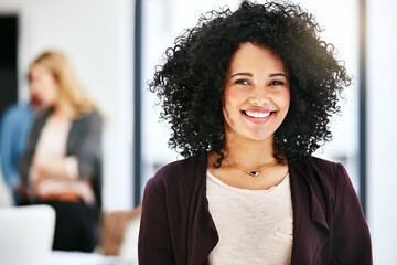 Closeup portrait of a happy, successful and confident business woman standing in a office. Beautiful African American female smiling, with her colleagues in the blurred copyspace background. - Powered by Adobe