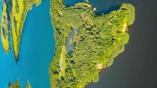 Vertical, Vertical Shot Time lapse Dronelapse Hyperlapse. Aerial View Of Island Pension Lode In Autumn Morning. Morning Fog Above Lepel Lake. Top View Of European Nature From High Attitude In Autumn