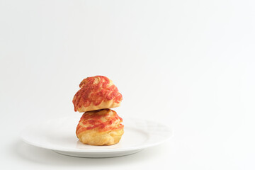 Choux pastry contains butter, water, flour, and eggs. Choux pastries are sometimes filled with cream to make cream puffs. 
