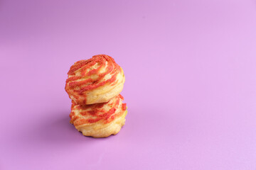 Choux pastry contains butter, water, flour, and eggs. Choux pastries are sometimes filled with cream to make cream puffs. 
