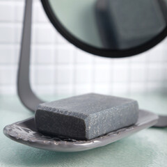 Obraz na płótnie Canvas Black soap in the bathroom