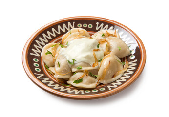 Traditional Ukrainian dumplings, vareniki with mushrooms and potatoes in a ceramic painted bowl with ingredients isolated on white background. - 520947145