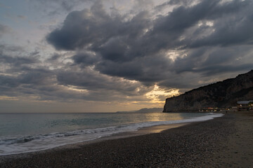 Fototapeta na wymiar Clouds over the sea in evening, Finale Ligure, Liguria, Italy