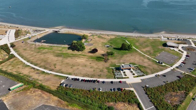 Orbiting aerial shot of Windjammer Park in Oak Harbor, Washington.