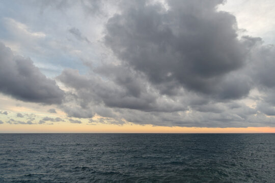 Cumulus clouds hovering over the Ligurian sea, Italy