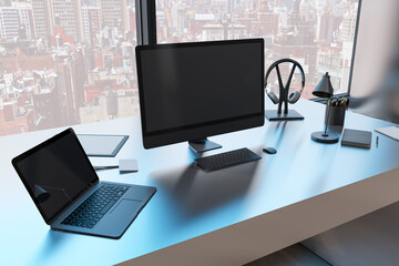 Close up of creative designer workplace with empty black mock up computer monitor laptop and supplies in modern office with window and panoramic city view. 3D Rendering.