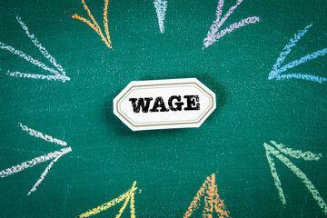 WAGE. Sticky note with text on a chalkboard background