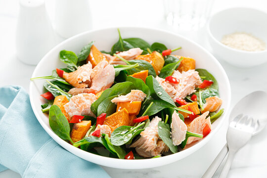 Spinach, salmon and sweetpotato festive thansgiving salad with paprika