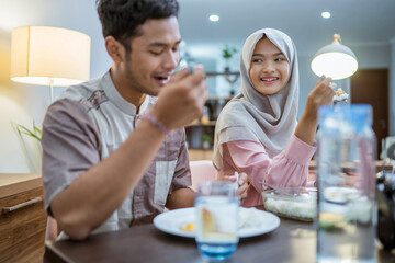 muslim couple wake up having early morning breakfast or sahoor before fasting