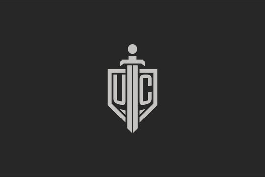 Letter UC logo with shield and sword icon design in geometric style