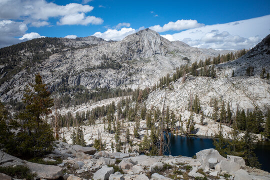 Beautiful epic shot of mountain range and forest with alpine lake in Sequoia National Park, California