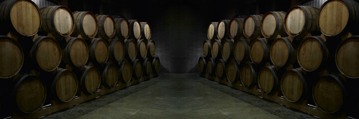 Wine or cognac barrels in the cellar of the winery, Wooden wine barrels in perspective. wine...